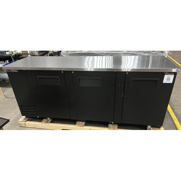 Scratch and Dent True TBB-4-HC 90 3/8" Black Solid Door Back Bar Refrigerator with LED Lighting