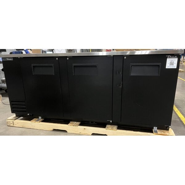 Scratch and Dent True TBB-4-HC 90 3/8" Black Solid Door Back Bar Refrigerator with LED Lighting