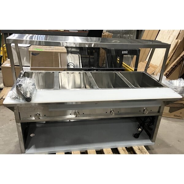 Scratch and Dent ServIt Four Pan Open Well Electric Steam Table with Partially Enclosed Base and Angled Sneeze Guard - 120V, 2000W