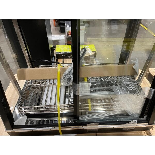 Scratch and Dent Avantco HDC-26 26" Self/Full Service 3 Shelf Countertop Heated Display Case with Sliding Doors - 120V, 1580W