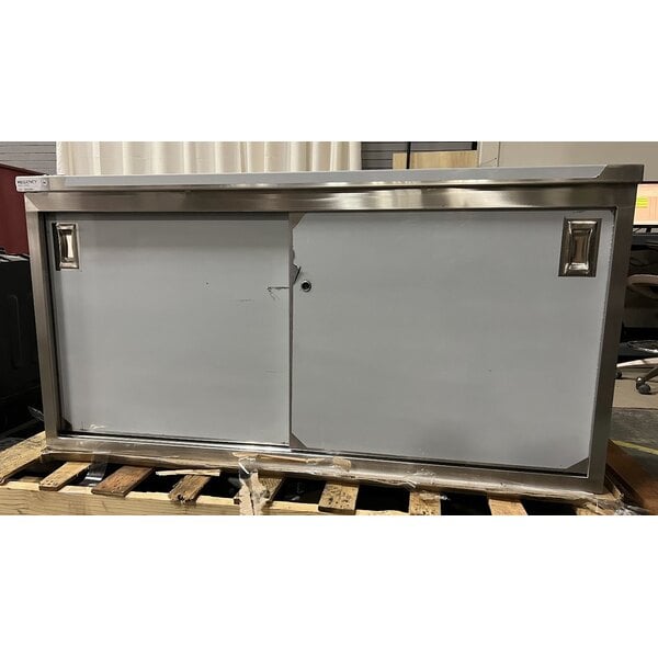 Scratch and Dent Regency 30" x 60" 16 Gauge Type 304 Stainless Steel Enclosed Base Table with Sliding Doors and Adjustable Midshelf