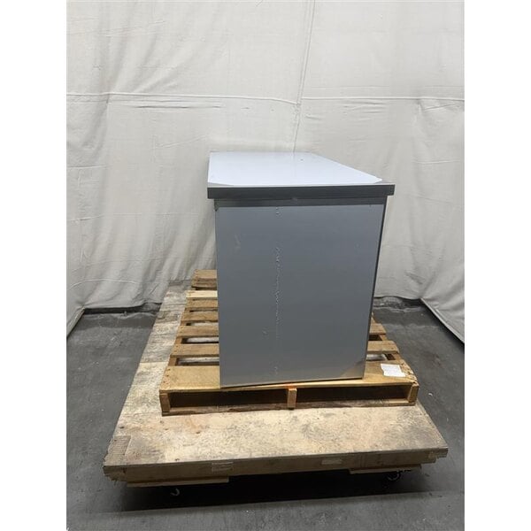 Scratch and Dent Regency 24" x 48" 16 Gauge Type 304 Stainless Steel Enclosed Base Table with Sliding Doors and Adjustable Midshelf