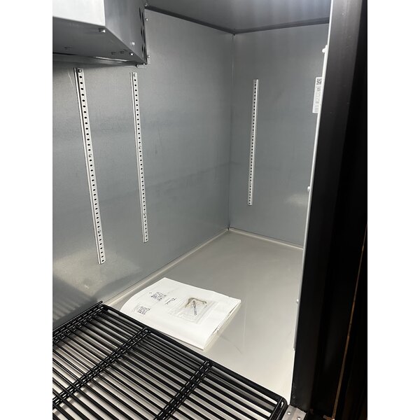 Scratch and Dent True TBB-4-HC 90 3/8" Black Counter Height Solid Door Back Bar Refrigerator with LED Lighting