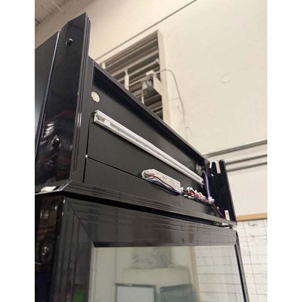 Scratch and Dent Avantco GDC-12F-HC 27" Black Swing Glass Door Merchandiser Freezer with LED Lighting