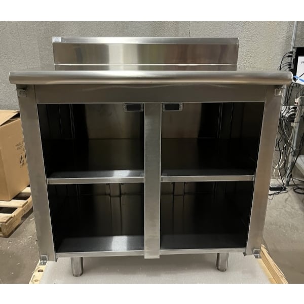 Scratch and Dent Advance Tabco HK-SS-243M 24" x 36" 14 Gauge Enclosed Base Stainless Steel Work Table with Fixed Midshelf and 5" Backsplash