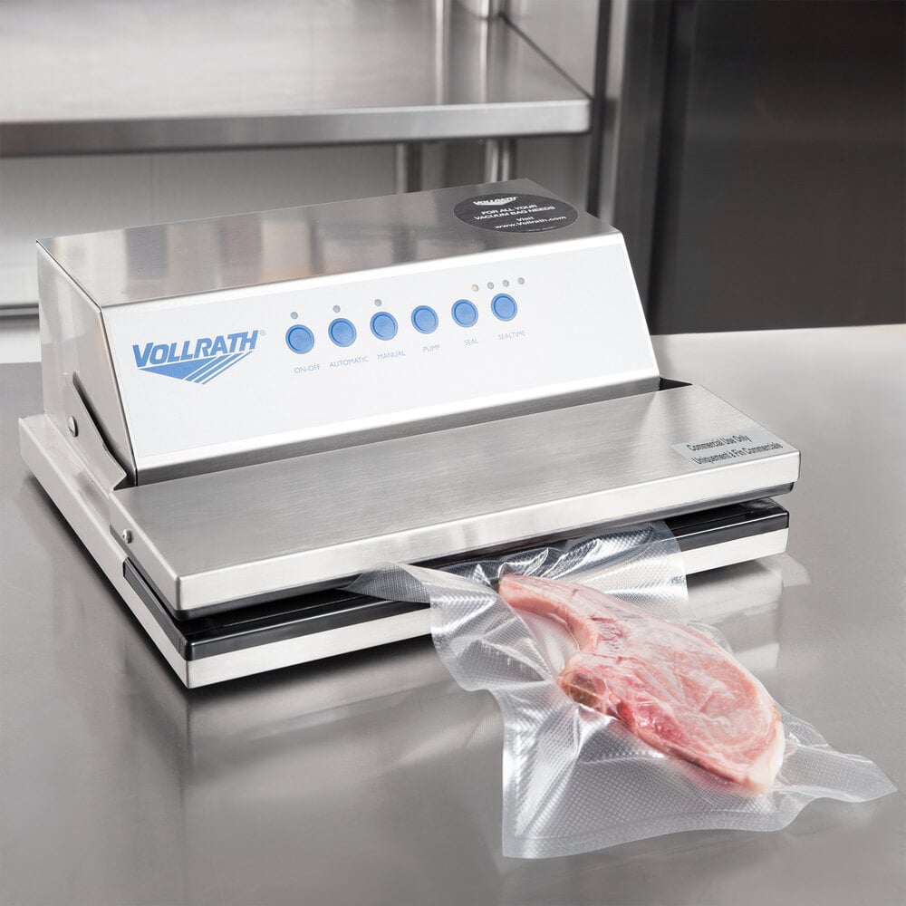 Sealed piece of raw meat coming out of Vollrath external vacuum sealer