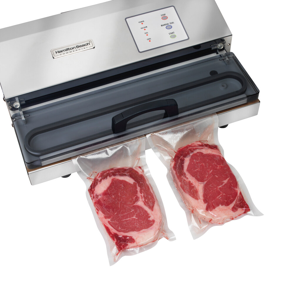 Two individually vacuum sealed steaks coming out of Hamilton Beach vacuum sealer