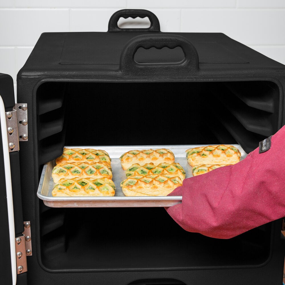 Carlisle black sheet pan carrier with one pan with baked goods on top