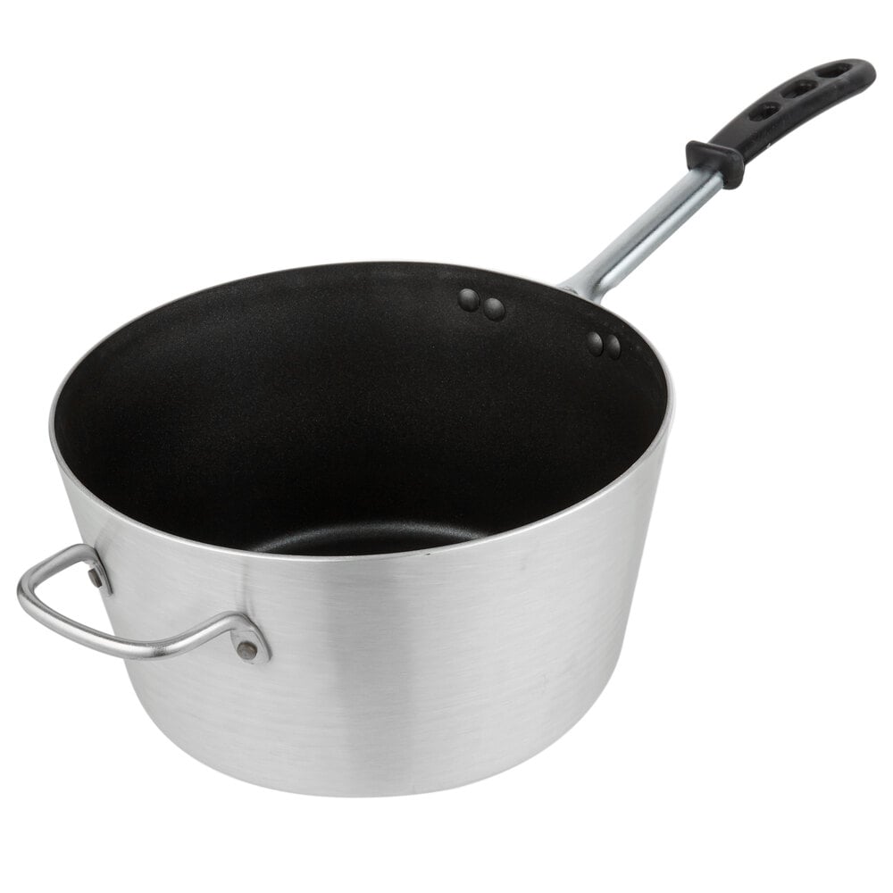 Image of a sauce pan with dark interior on a white backdrop