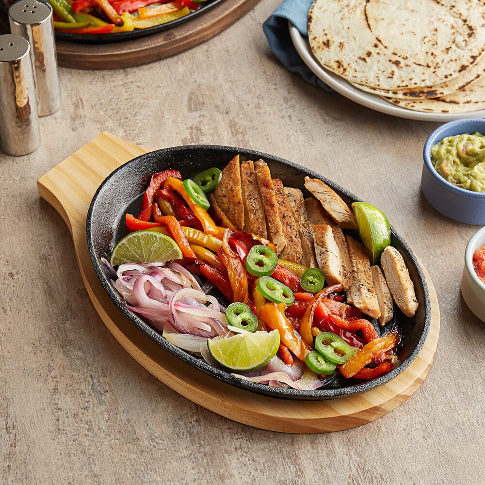 Choice 9 1/4" x 7" Oval PreSeasoned Cast Iron Fajita Skillet with