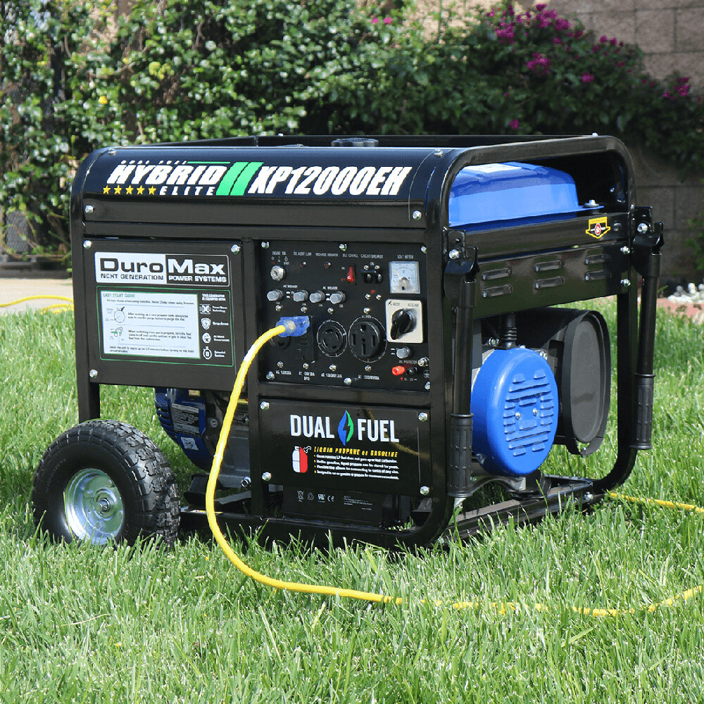 Blue DuroMax generator in the grass with yellow extension cord