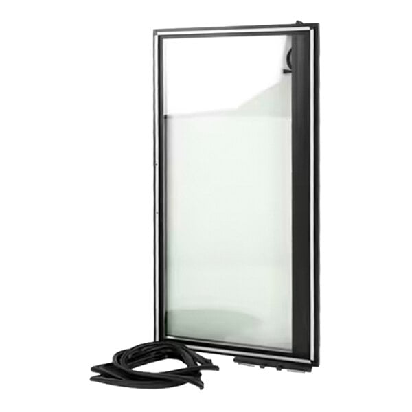 A rectangular glass door with a black frame, shown standing upright with a coiled black gasket or seal placed in front of it.