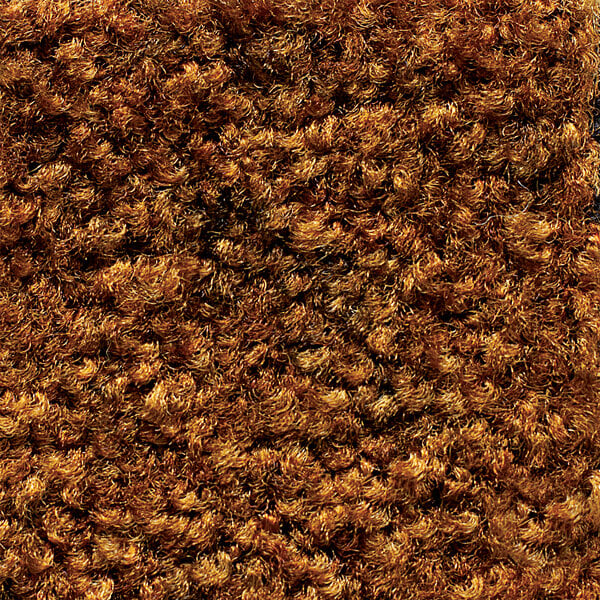 A close-up of a brown Cactus Mat carpet with a rubber backing.