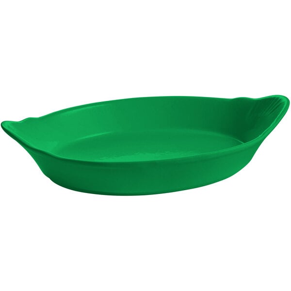 A green oval au gratin dish with a handle.