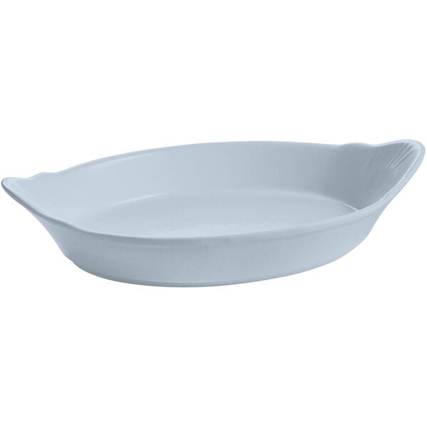 A white oval shaped Tablecraft au gratin dish.