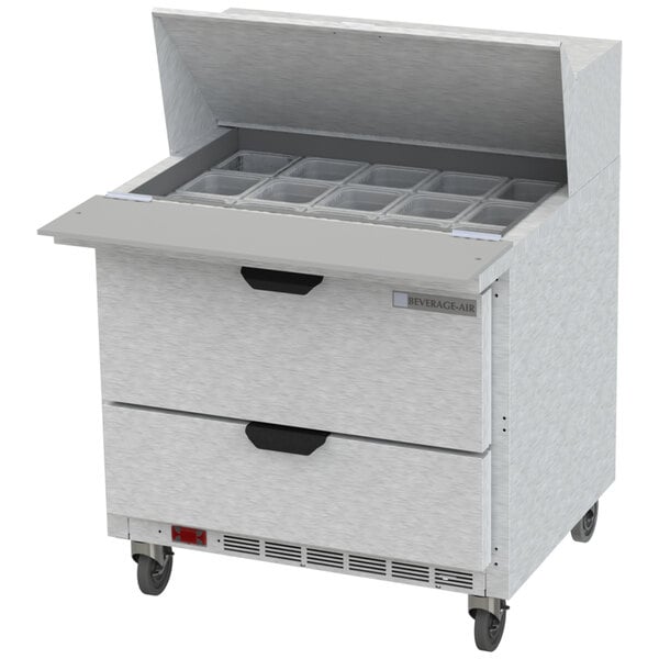 A Beverage-Air refrigerated sandwich prep table with 2 drawers open on a counter.