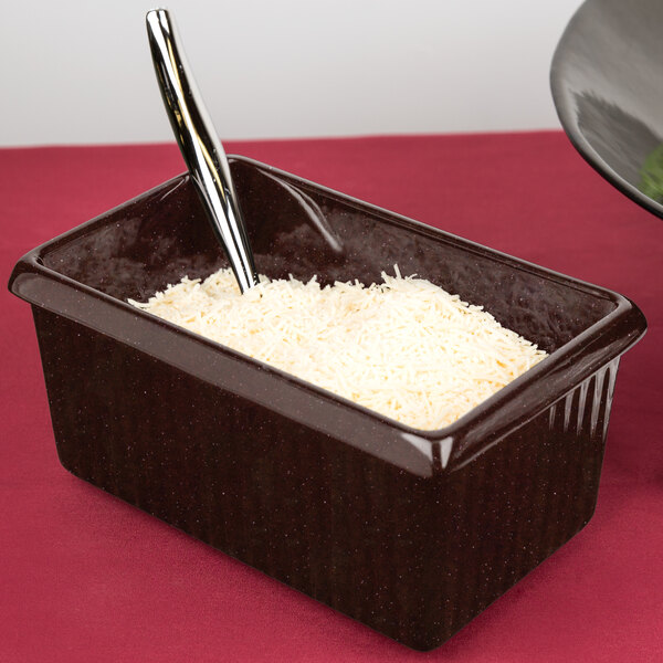 A brown rectangular Tablecraft server with white food in it.