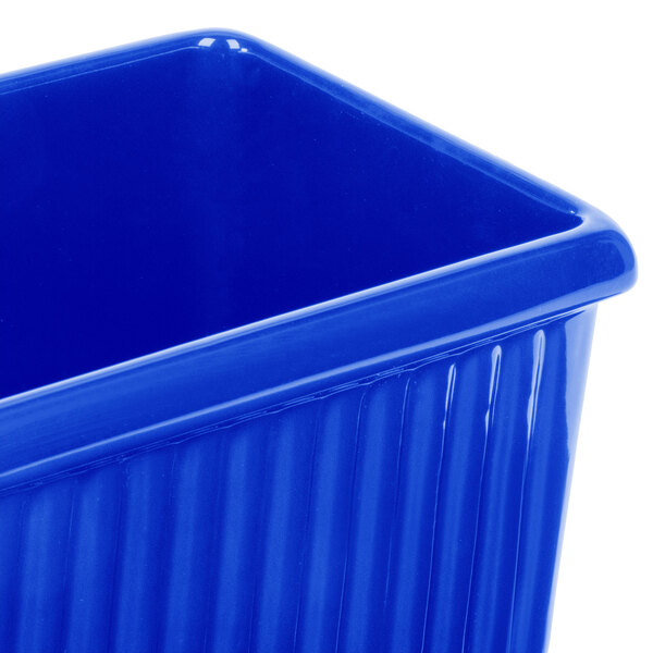 A cobalt blue rectangular Tablecraft server with a lid.