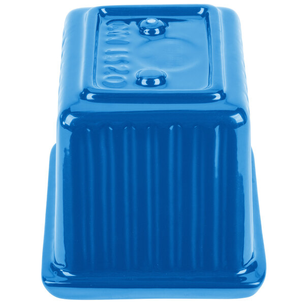 A sky blue rectangular cast aluminum server with ridges.