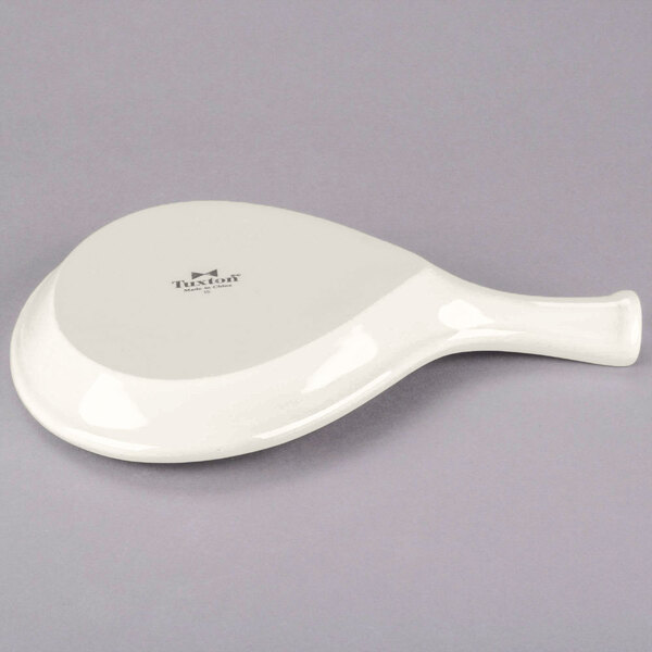 A white Tuxton China fry pan server.