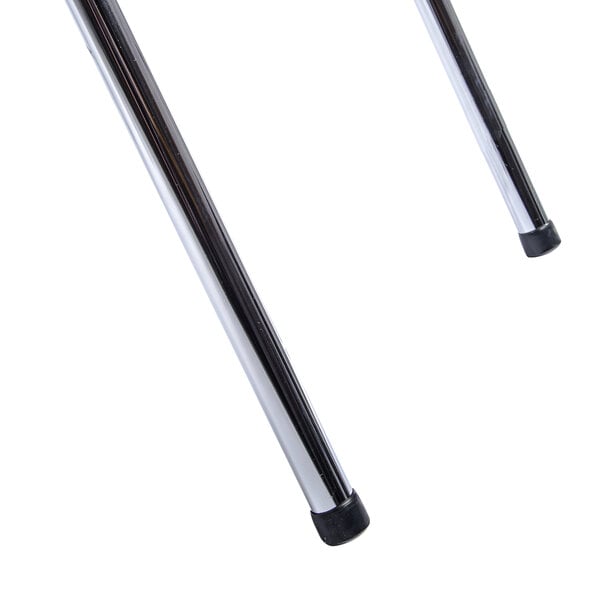 A close-up of a pair of metal rods with a black rubber tip.