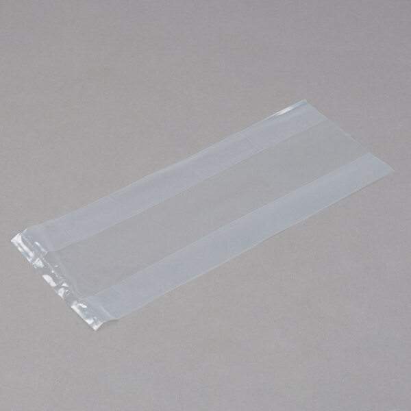 A clear plastic bag on a grey surface.