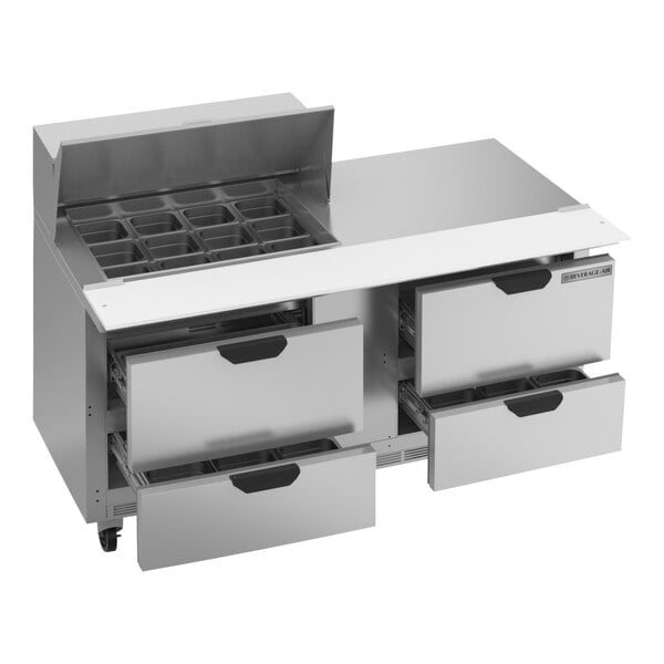 A silver Beverage-Air refrigerator with 4 drawers on a stainless steel counter.