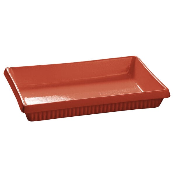 A Tablecraft copper rectangular casserole dish with a handle.