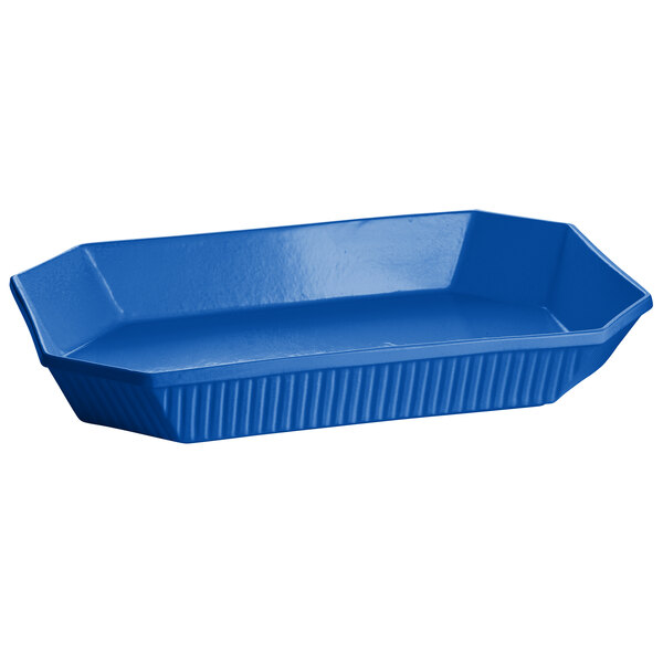 A cobalt blue cast aluminum octagon casserole dish with a white background.