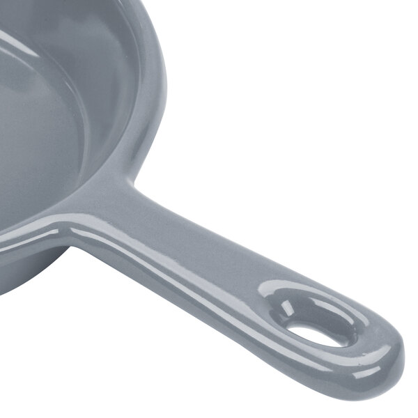 A Tablecraft gray cast aluminum fry pan with a handle.