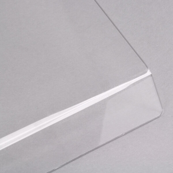 A clear plastic panel with a white edge.