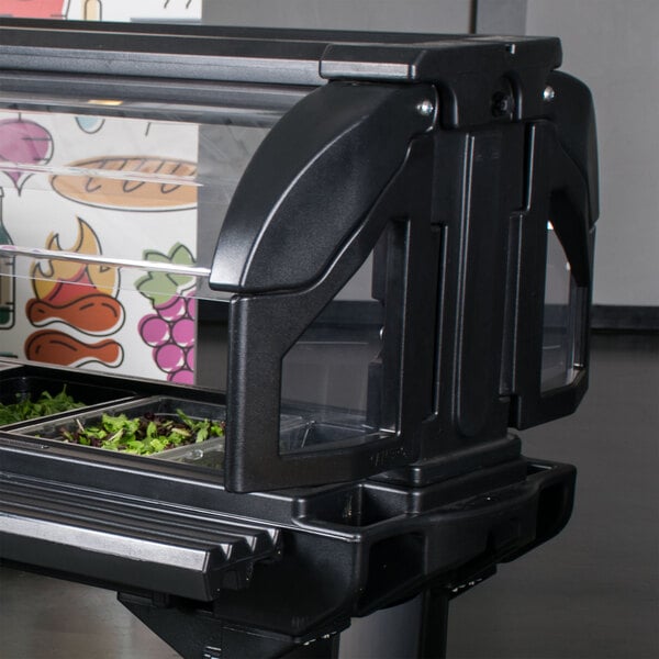 A food display with a salad bar using a Cambro Sneeze Guard.