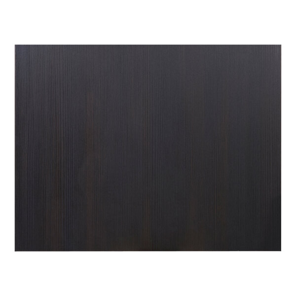 A close up of a black wood surface with a white border.