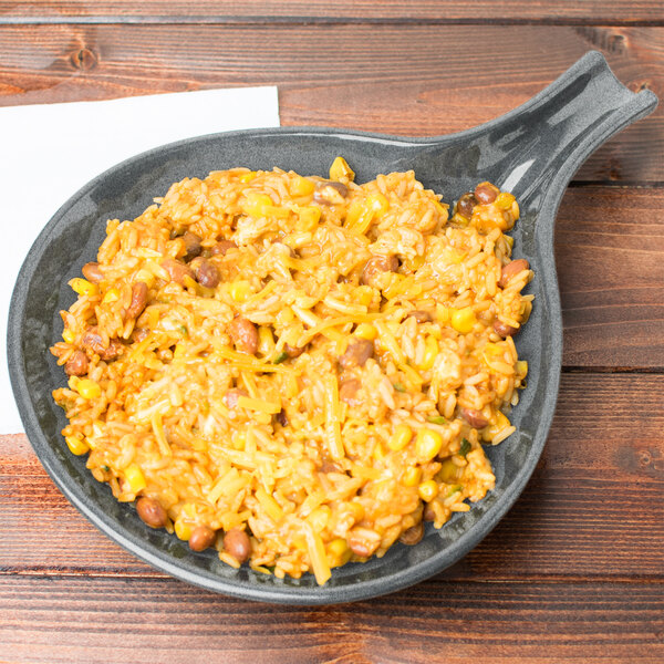 A Tablecraft granite cast aluminum skillet filled with rice and beans on a table.