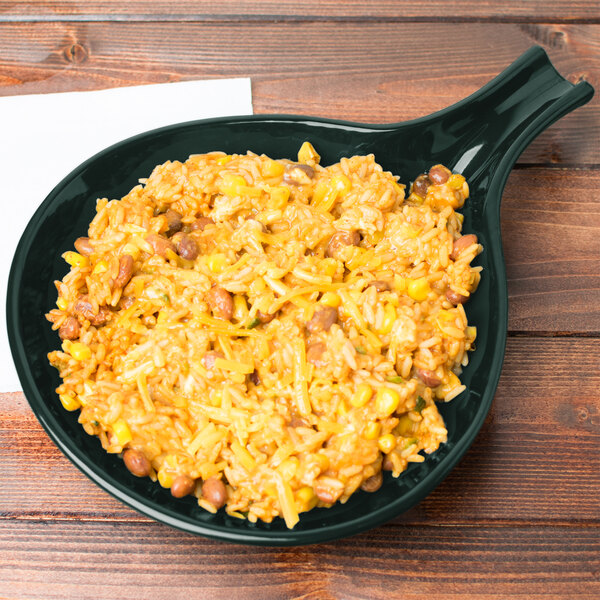 A Hunter Green Tablecraft cast aluminum fry pan filled with rice and beans.