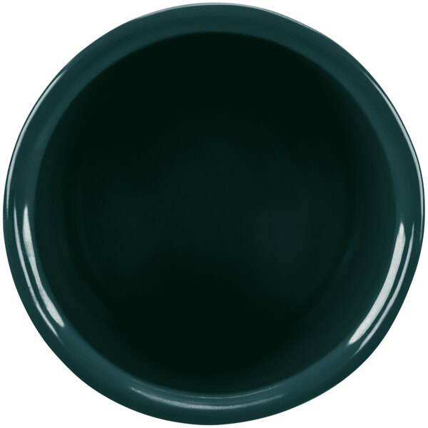 A close-up of a hunter green Tablecraft salad dressing bowl.