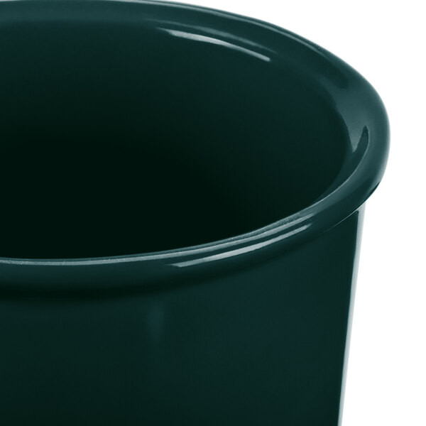 A Tablecraft hunter green cast aluminum salad dressing bowl.