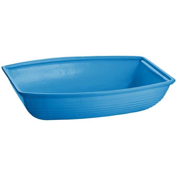 A sky blue cast aluminum oblong bowl with a handle.