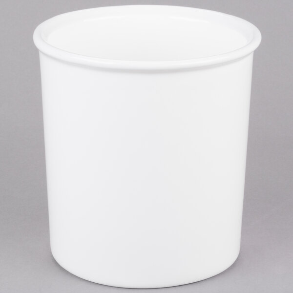 A white cast aluminum bowl with a lid.