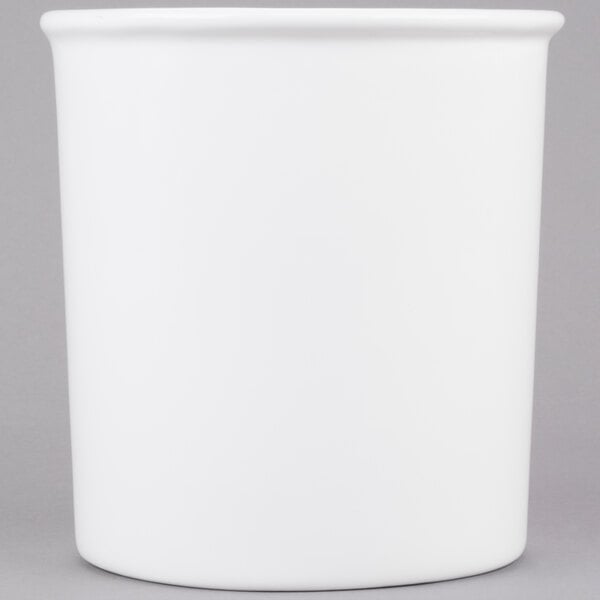 A white Tablecraft cast aluminum salad dressing bowl with a lid.