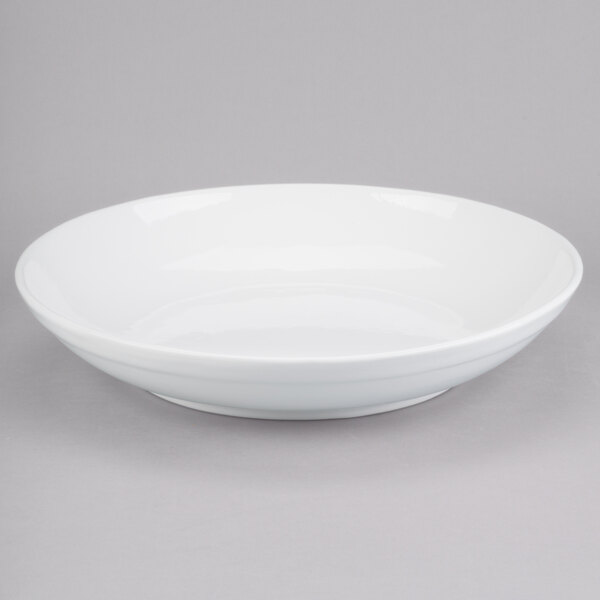 A Tablecraft white cast aluminum pasta bowl.