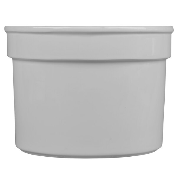 A white round Tablecraft natural cast aluminum half soup bowl.