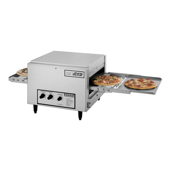 A Star Miniveyor conveyor oven with two pizzas cooking inside.