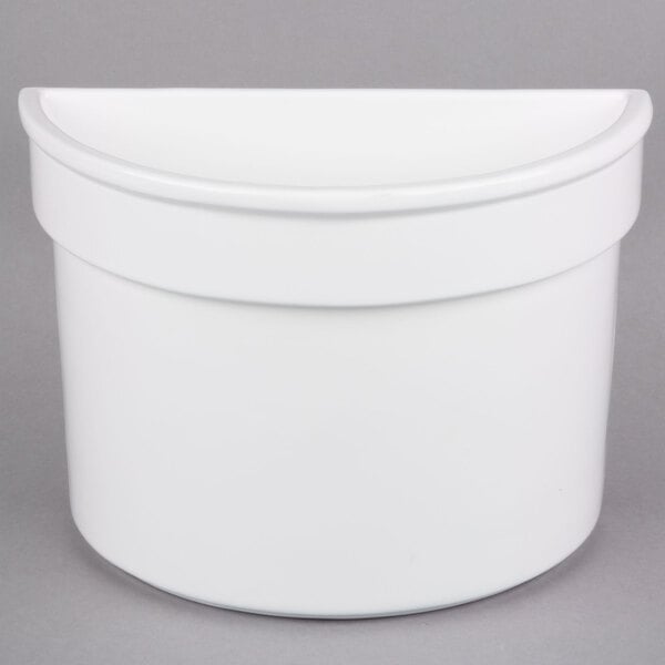 A white Tablecraft cast aluminum half bowl with a curved edge.