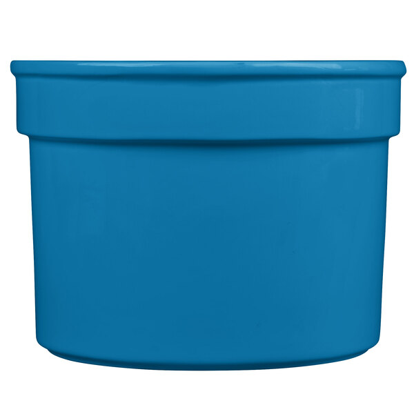 A sky blue cast aluminum half soup bowl with a white background.