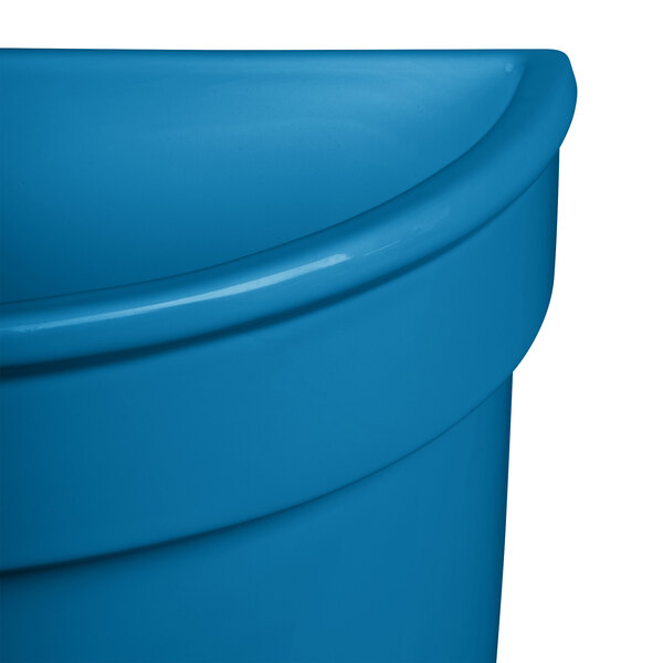 A Tablecraft sky blue cast aluminum half soup bowl.