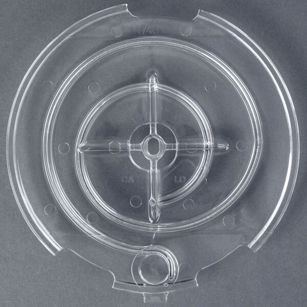 A clear plastic container with a circular hole in it.