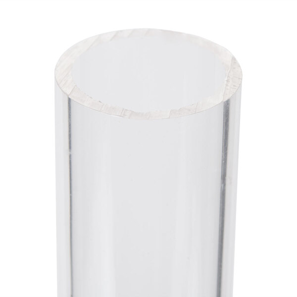 A clear cylinder with a hole in it.