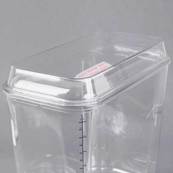 A clear plastic lid on a Grindmaster Cecilware refrigerated beverage dispenser bowl.