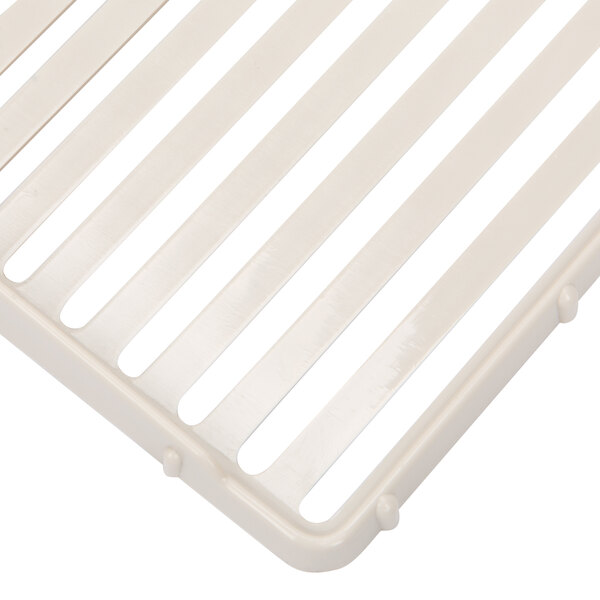 A white plastic grate for a Grindmaster Cecilware Refrigerated Beverage Dispenser.